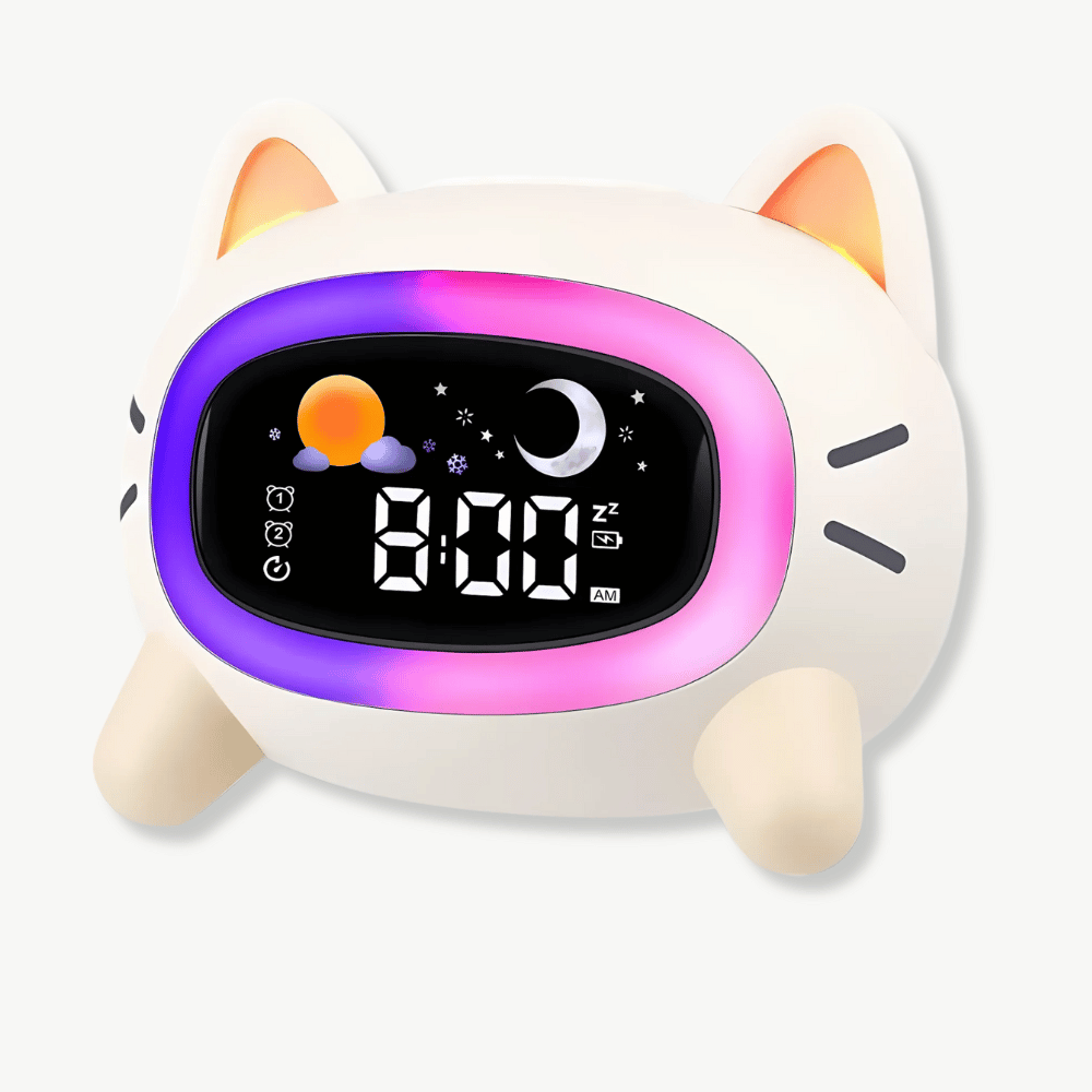 Budzik w kształcie kota z podświetleniem LED na stoliku nocnym